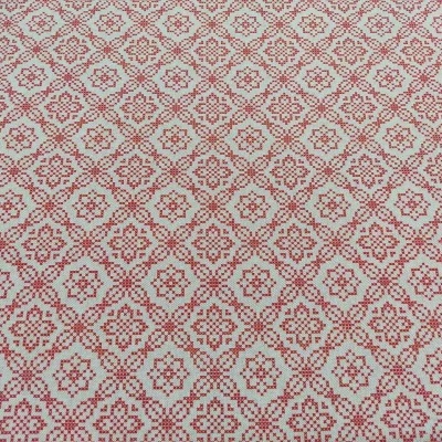 Tecido vermelho e branco com padrão geométrico repetitivo