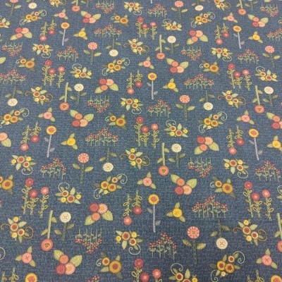 Tecido azul com padrão floral colorido