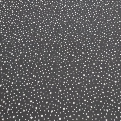 Tecido preto com estrelas brancas pequenas e repetidas