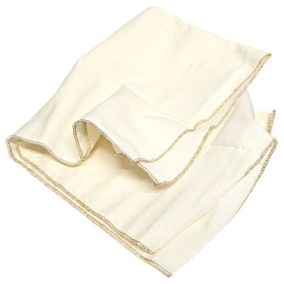 Pano de tecido branco creme dobrado com costura bege