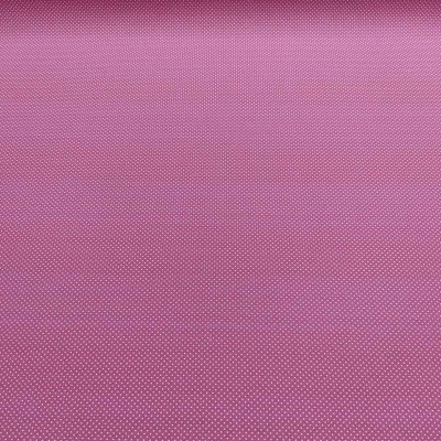 Tecido cor-de-rosa com padrão de pontos pequenos brancos