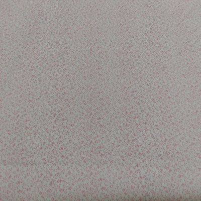 Tecido branco com pequenas flores vermelhas