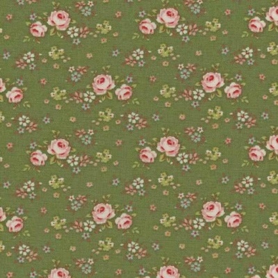 Pano verde com padrão de flores cor-de-rosa e pequenas flores brancas e amarelas.