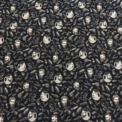 Tecido preto com padrão vintage de desenhos brancos repetidos