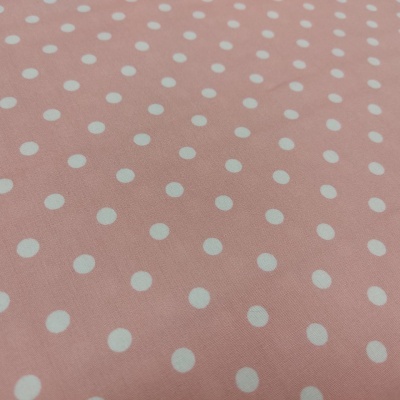 Tecido rosa com bolinhas brancas em padrão regular