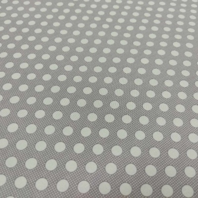 Tecido cinzento com padrão de bolinhas brancas