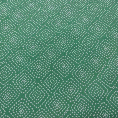 Tecido verde com padrão geométrico de pontos brancos formando quadrados