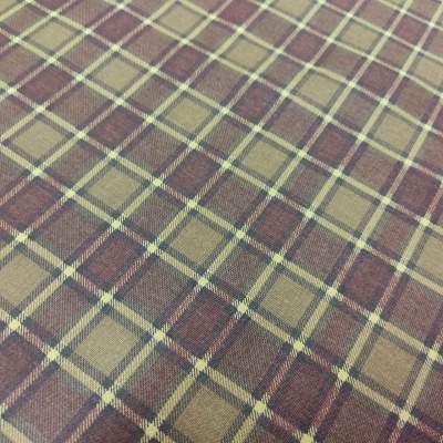 Tecido xadrez castanho e bege com textura visível