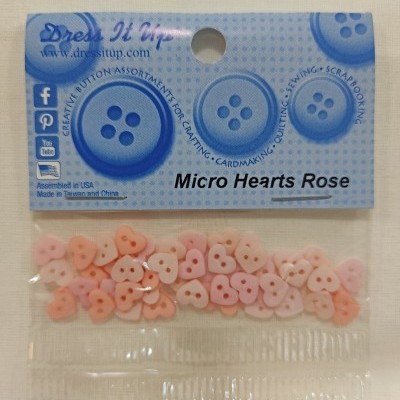 Pacote de botões pequenos cor-de-rosa em forma de coração com embalagem azul da marca Dress It Up