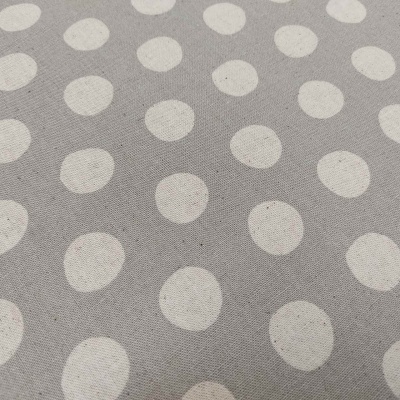 Tecido cinzento com padrão de bolinhas brancas