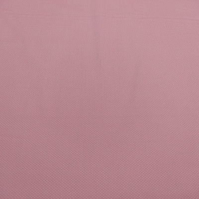 tecido rosa com pequenos pontos brancos