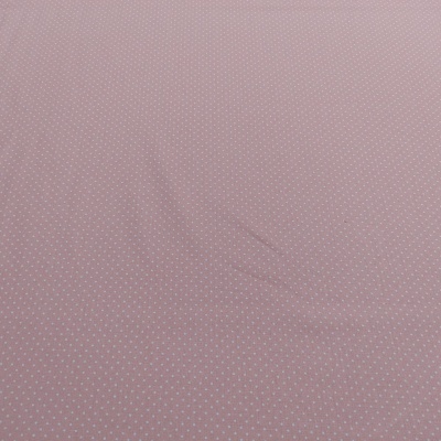 tecido rosa com pontos brancos pequenos