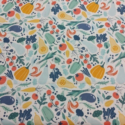 Tecido com padrão colorido de vegetais em fundo branco