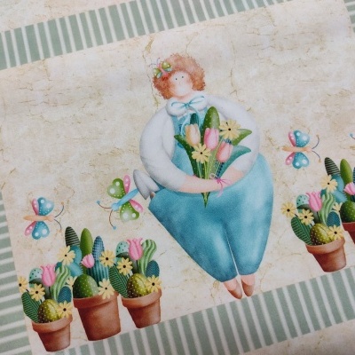 Tela decorativa com figura caricata, flores, cactos e borboletas