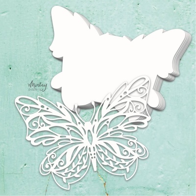 Borboletas recortadas em papel branco com padrão decorativo em arabescos