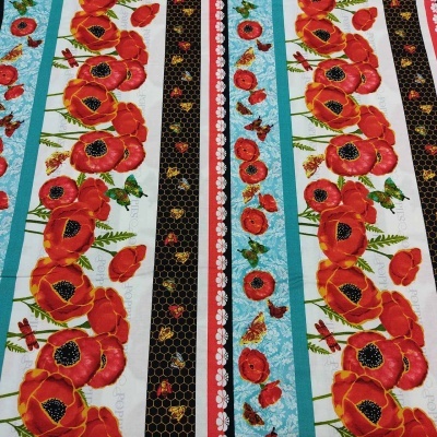 Tecido com riscas verticais de flores vermelhas e detalhes pretos e azuis turquesa