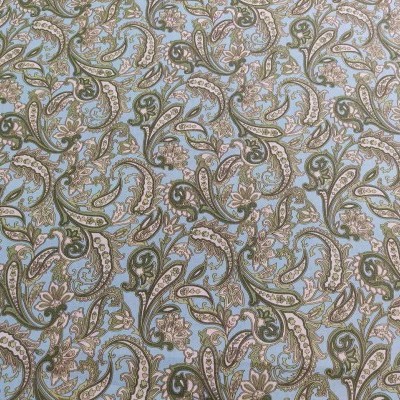 tecido estampado com floral e arabescos em tons de verde, azul e bege