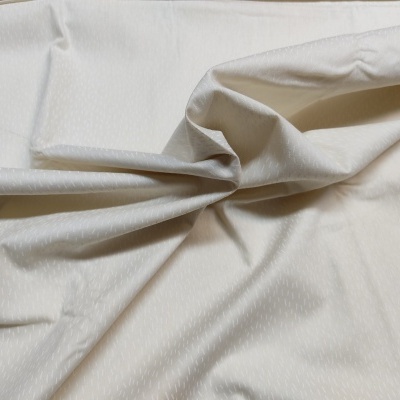 tecido bege claro com textura suave e dobras