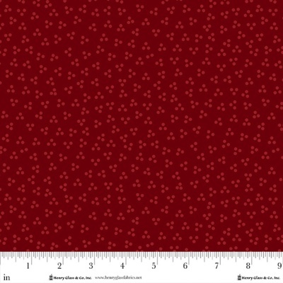 Tecido vermelho com padrão floral vermelho escuro e régua para medição