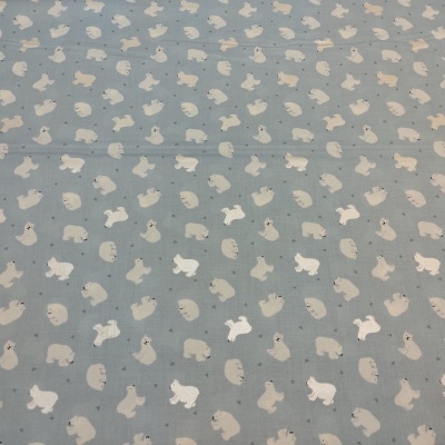 Tecido azul claro com padrão de coelhos pequenos em cores neutras