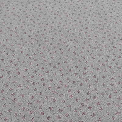 Tecido cinzento com padrão de pequenas flores vermelhas e folhas verdes