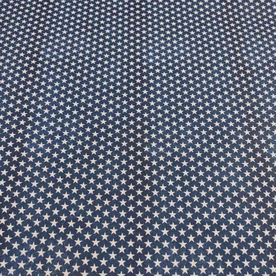 tecido azul com padrão de estrelas brancas