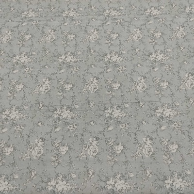 Tecido cinzento azulado com padrão floral branco e bege