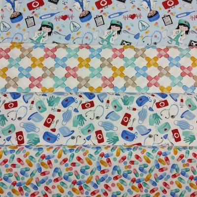 Quatro tecidos com padrões médicos e coloridos dispostos em camadas.