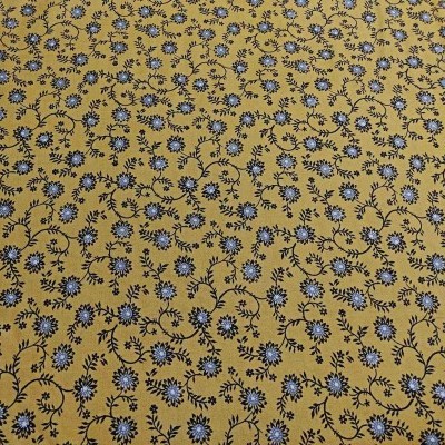tecido amarelo com padrão floral azul e preto