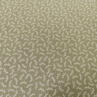 tecido verde-oliva com padrão de ramos brancos