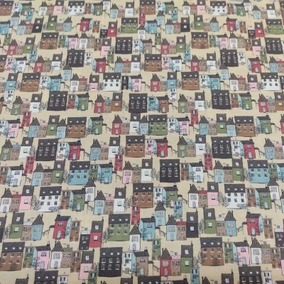 Tecido padrão casas coloridas sobre fundo bege claro