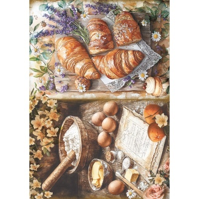 Croissants, ovos, manteiga, farinha, clementinas e flores sobre mesa rústica.