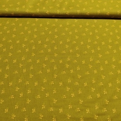 Tecido verde-oliva com padrão de folhas amarelas.