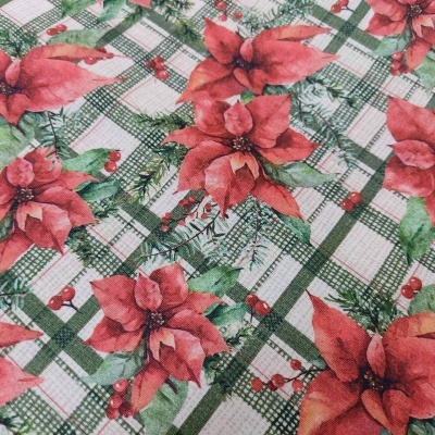 Tecido natalício com poinsétias vermelhas e padrão de quadrícula verde e branco