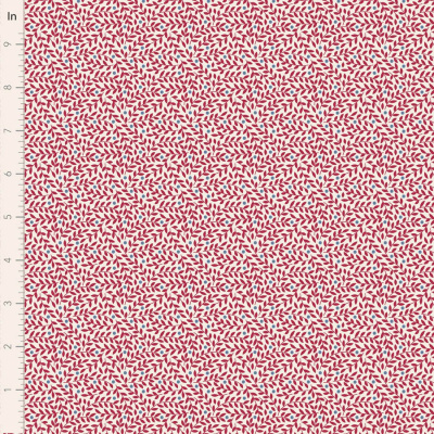 Tecido com padrão de folhas vermelhas e azuis em fundo branco com régua ao lado