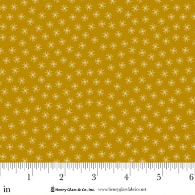 tecido amarelo mostarda com padrão de pequenos símbolos brancos e bege com régua em polegadas