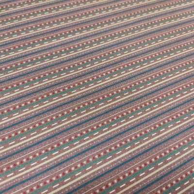 Tecido listrado com padrões geométricos em castanho, azul, vermelho e bege