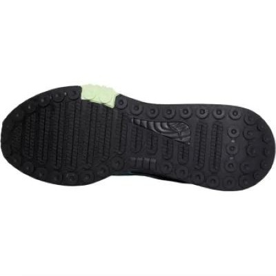 Sola de ténis preta com detalhe verde claro e padrão de ranhuras e círculos