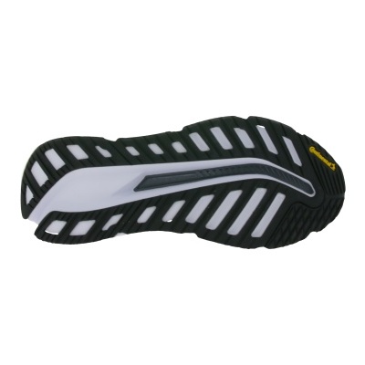 sola de sapato preta com detalhes em branco e cinzento com texto Vibram amarelo