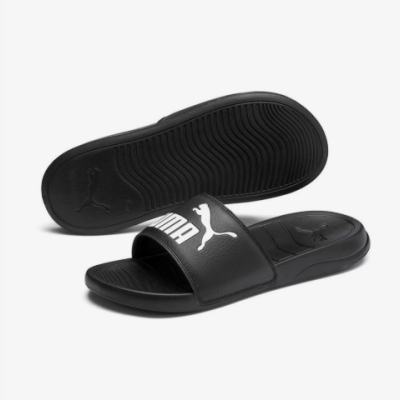 Chinelos Puma pretos com logo branco e sola texturizada