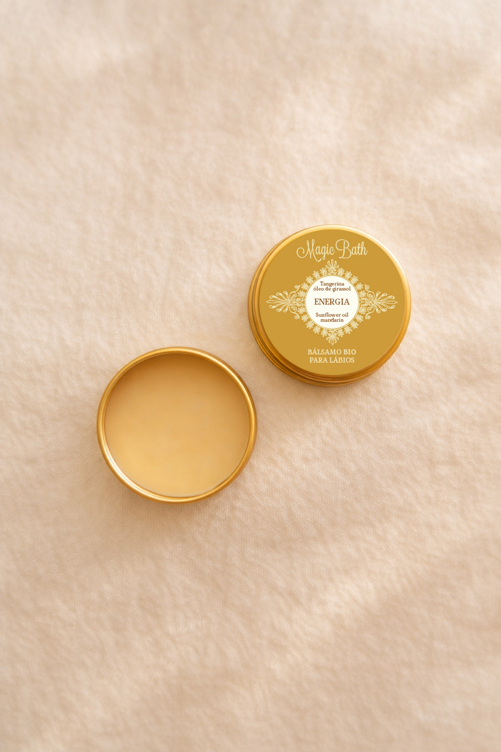 Bálsamo para Lábios - ENERGIA Bálsamo para lábios em embalagem metálica dourada com tampa escrita em branco