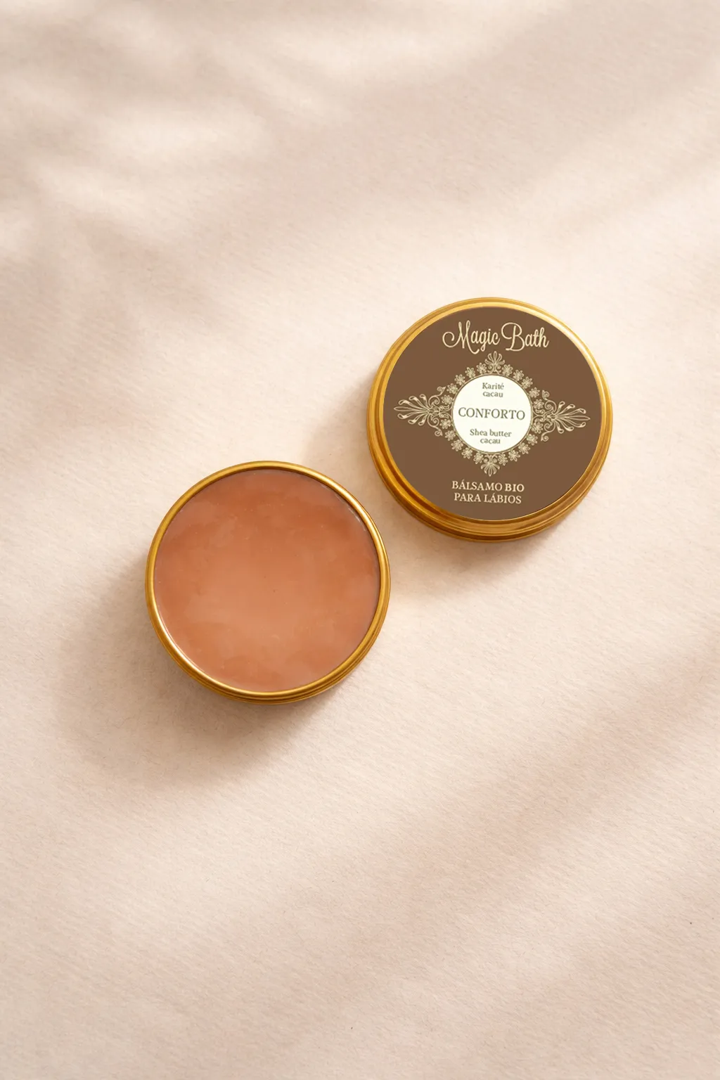 Bálsamo para Lábios - CONFORTO Bálsamo bio para lábios Magic Bath em embalagem dourada e castanha