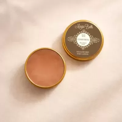Bálsamo bio para lábios Magic Bath em embalagem dourada e castanha