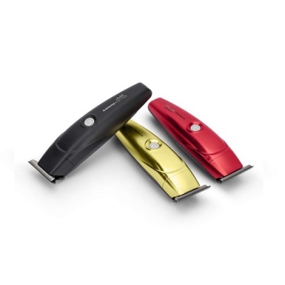 Três máquinas de cortar cabelo em cores preto, dourado e vermelho com lâmina metálica