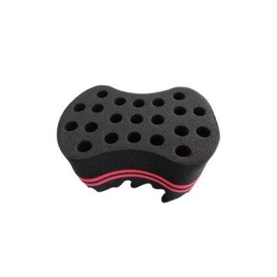 Esponja preta com orifícios circulares e linhas cor-de-rosa