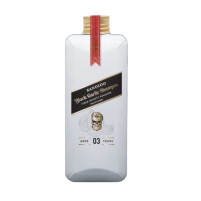 Frasco branco de shampoo Bandiddo Black Garlic com tampa dourada