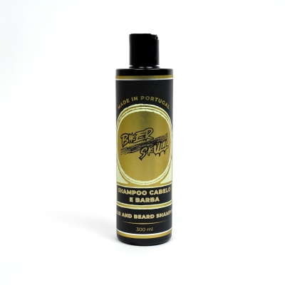 Frasco preto de shampoo cabelo e barba com rótulo dourado e texto em branco e preto