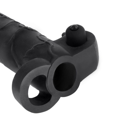 Brinquedo erótico preto em silicone com textura irregular e botão no topo