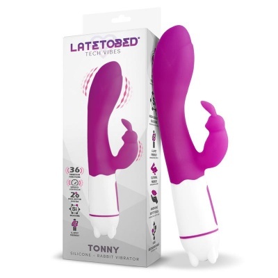 Vibrador cor de rosa com duas pontas, embalagem branca contendo informações técnicas.