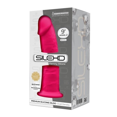 Dildo de silicone cor rosa em embalagem com texto e selo dourado.